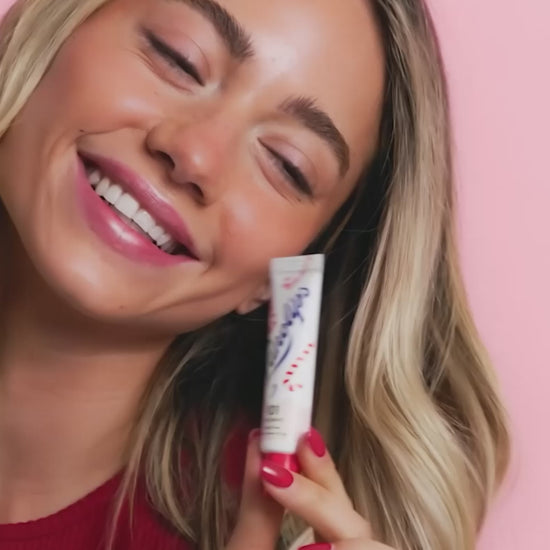 Video of model using the Lanolips 101 Ointment Multi-Balm Candy Cane, a limited edition festive gourmand flavour. 